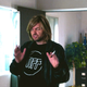 Dave (Paul Scheer) in a Stiff Records t-shirt